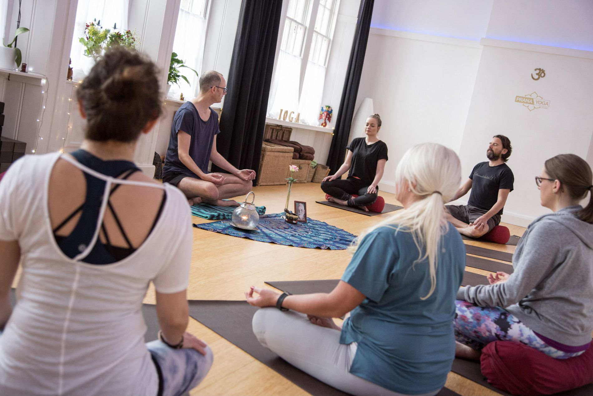 Teachers and students sharing a practice at Prana